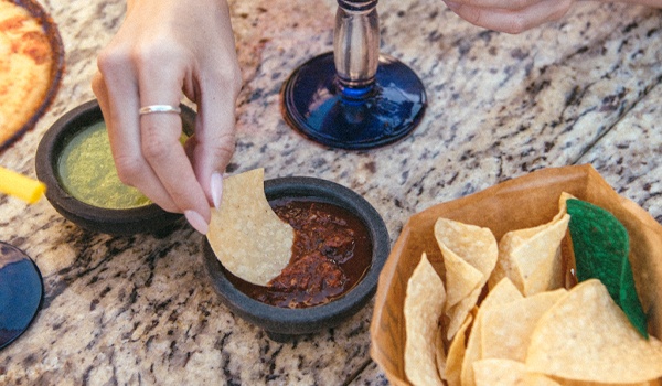 cocktail with nachos and sauces