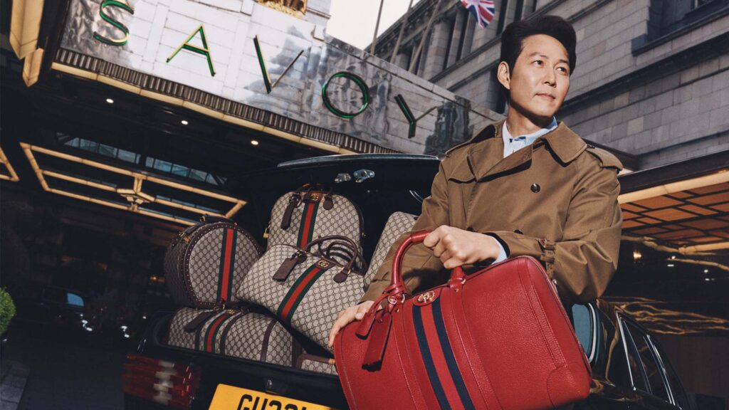 Gucci Global Brand Ambassador Jungjae Lee in front of the Savoy hotel